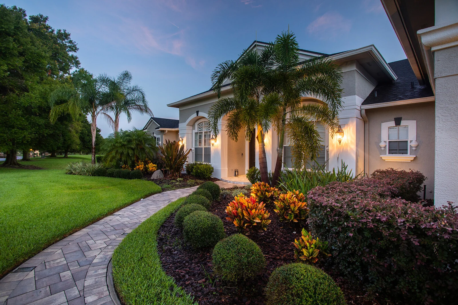 Refined front-yard planting and walkway creating polished curb appeal