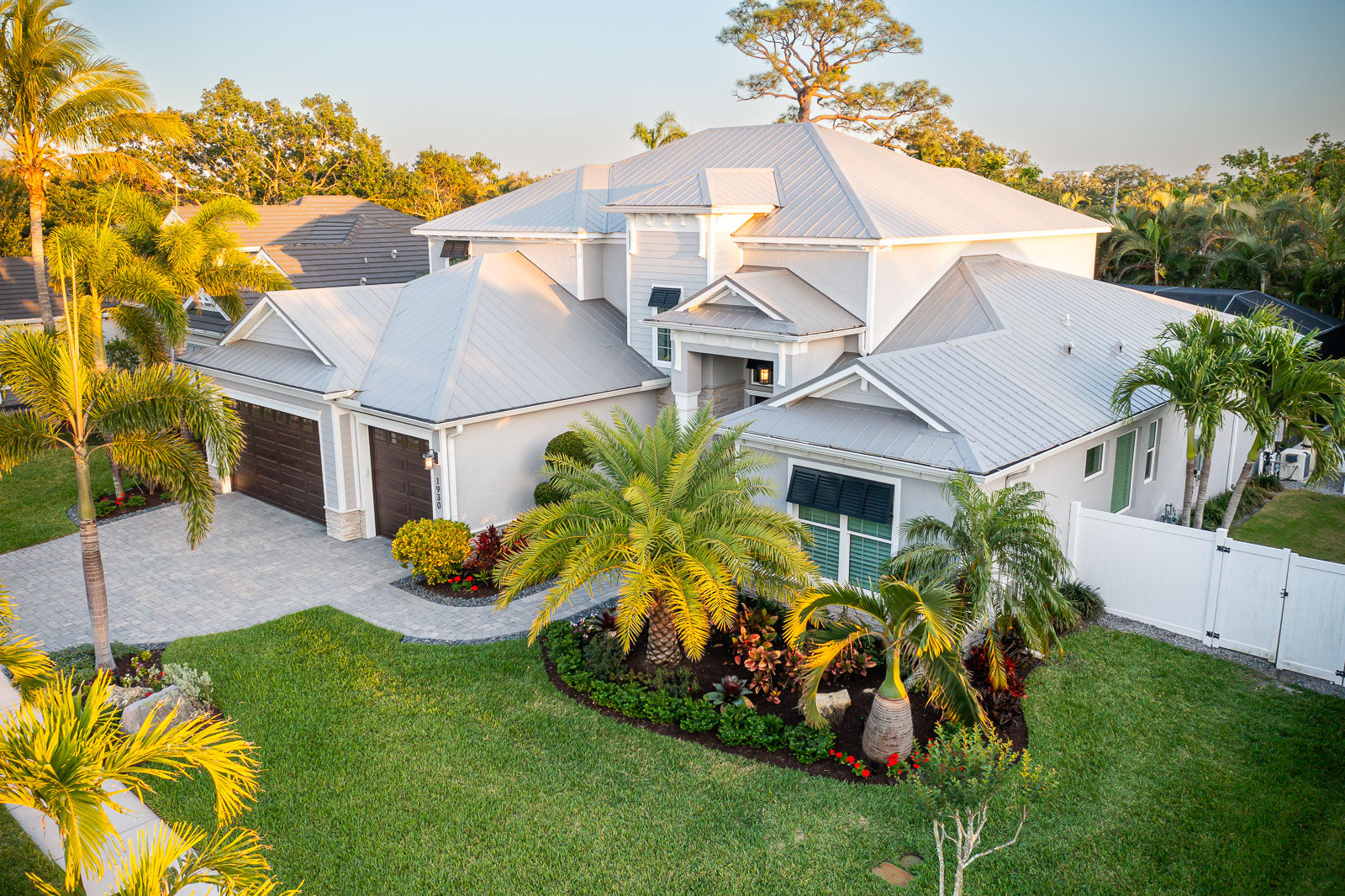 Aerial view of a landscaped Florida property with tropical planting beds